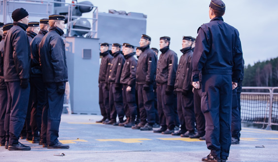  Naval soldiers stand in the form on a ship's deck
