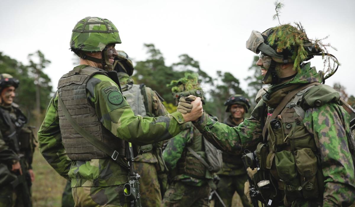 Two soldiers shaking hands