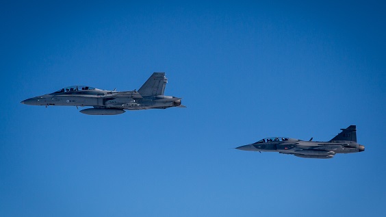 F/A-18D Hornet and a Swedish Air Force JAS 39D Gripen.